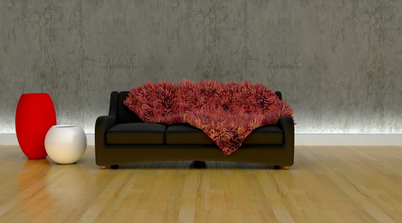 a fluffy rug on a sofa, with two floor vases in red and white colors nearby